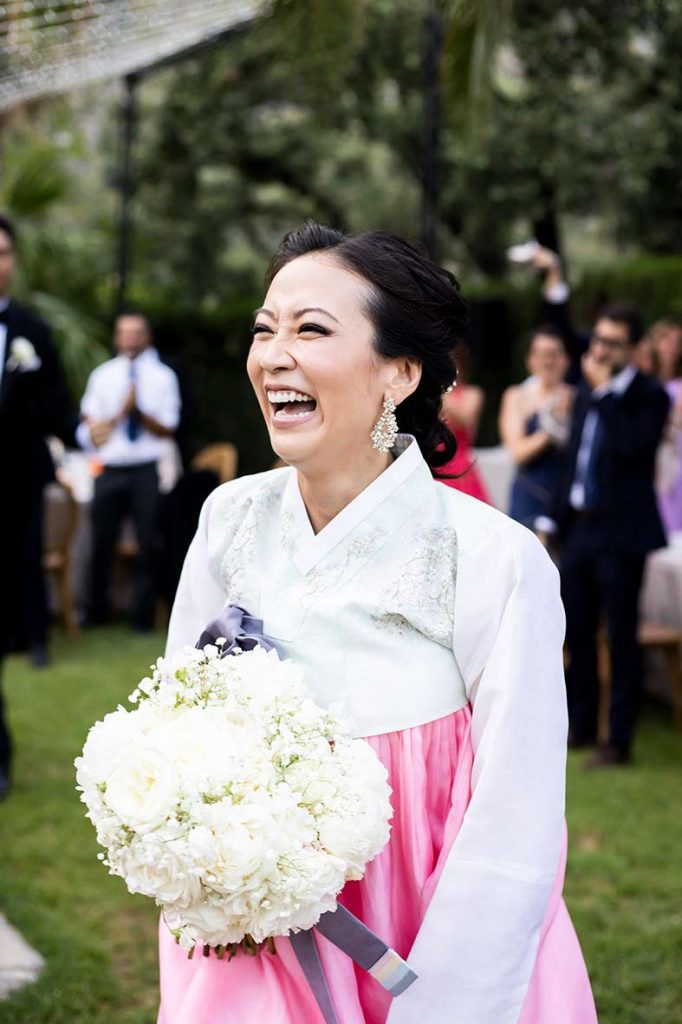 "ALT"boda coreana en finca comassema mallorca sonriendo entrada banquete"