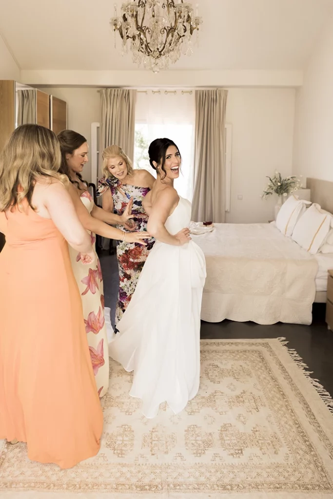 Bride getting ready with the help of her bridesmaids in a luxury villa in Sitges.