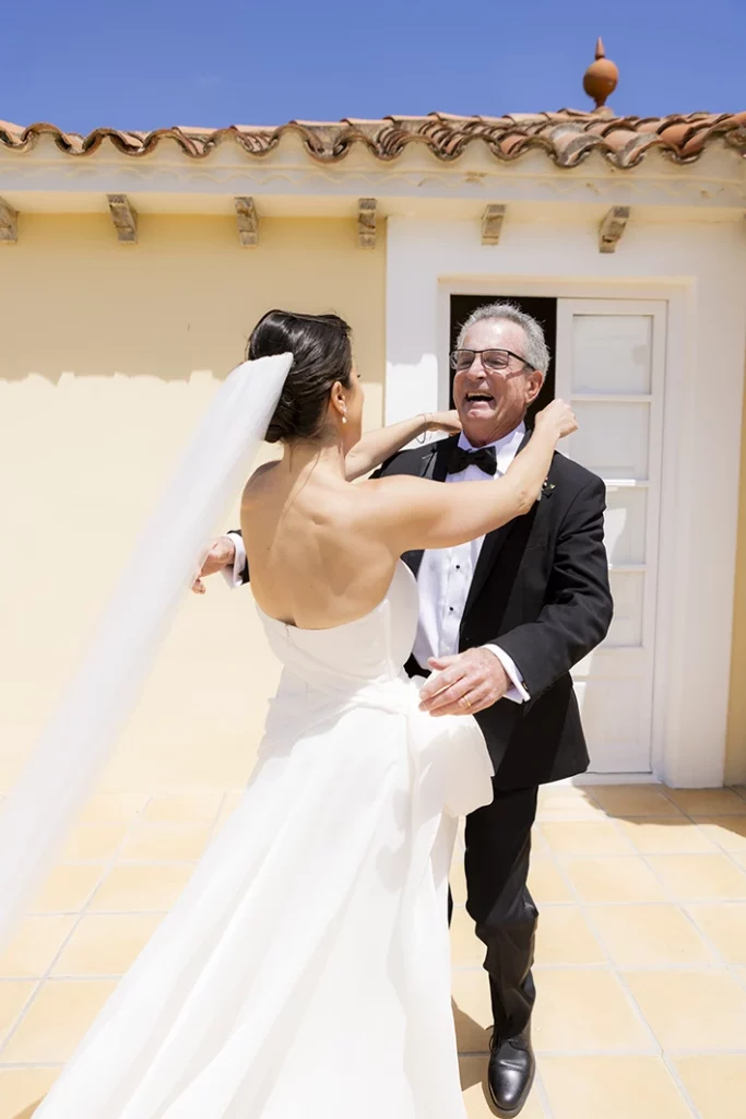 Emotional first look between bride and her father in Sitges.