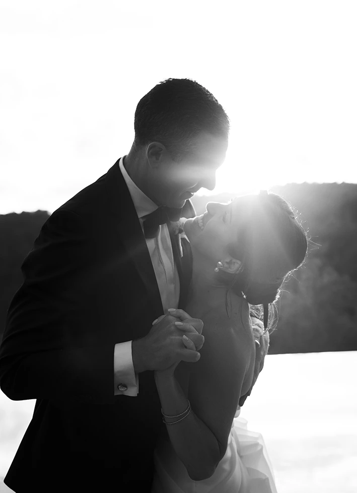 Bride and groom dancing at sunset during their wedding in Sitges.