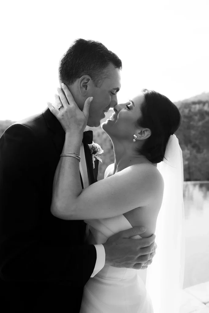 Bride and groom sharing an intimate moment during their wedding in Sitges.