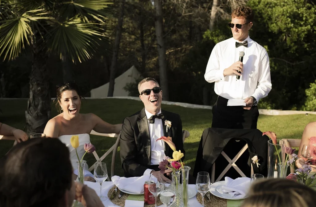 Groom Matt smiling during a wedding speech at his luxury wedding in Sitges.