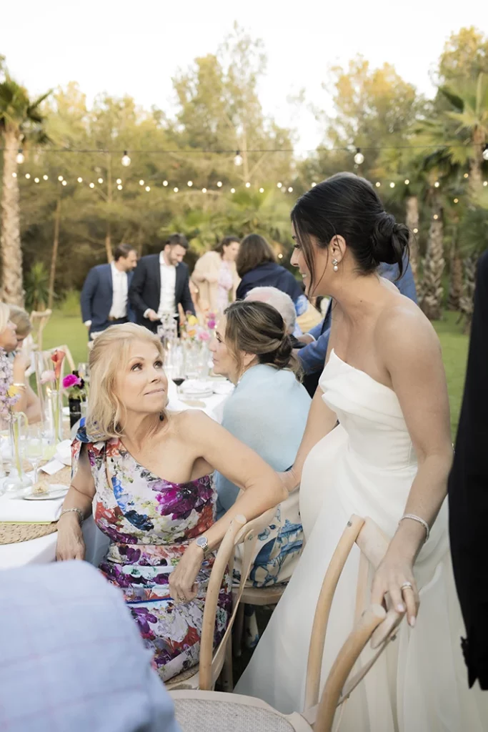 Bride greeting guests at a luxury wedding in Sitges.