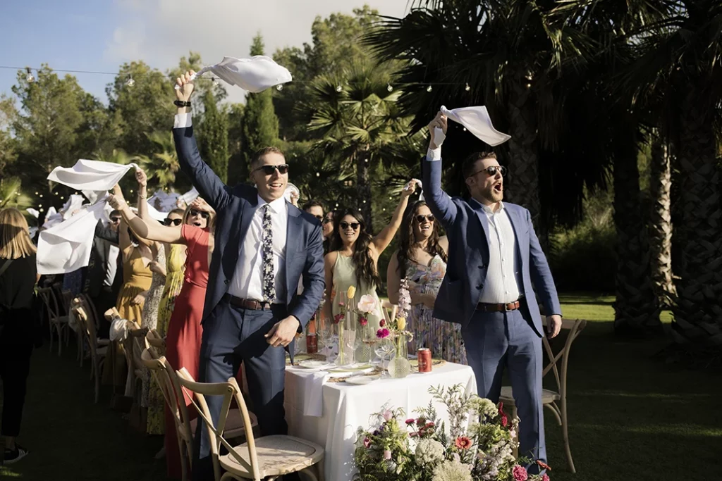 Guests cheering at a luxury wedding in Sitges.