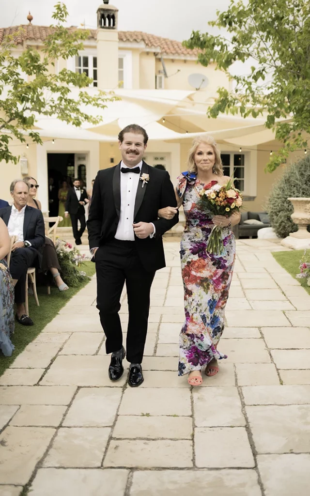 Guests walking down the aisle at a luxury wedding in Sitges.