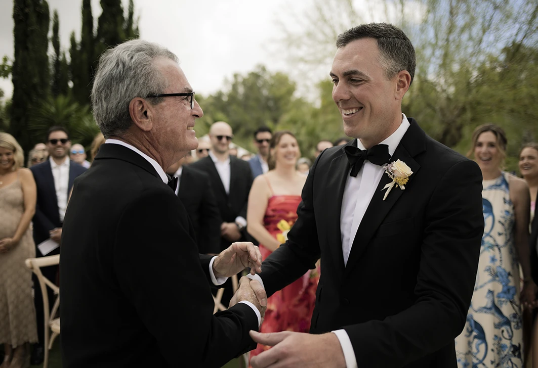 Groom shaking hands with the bride’s father at a luxury wedding in Sitges.