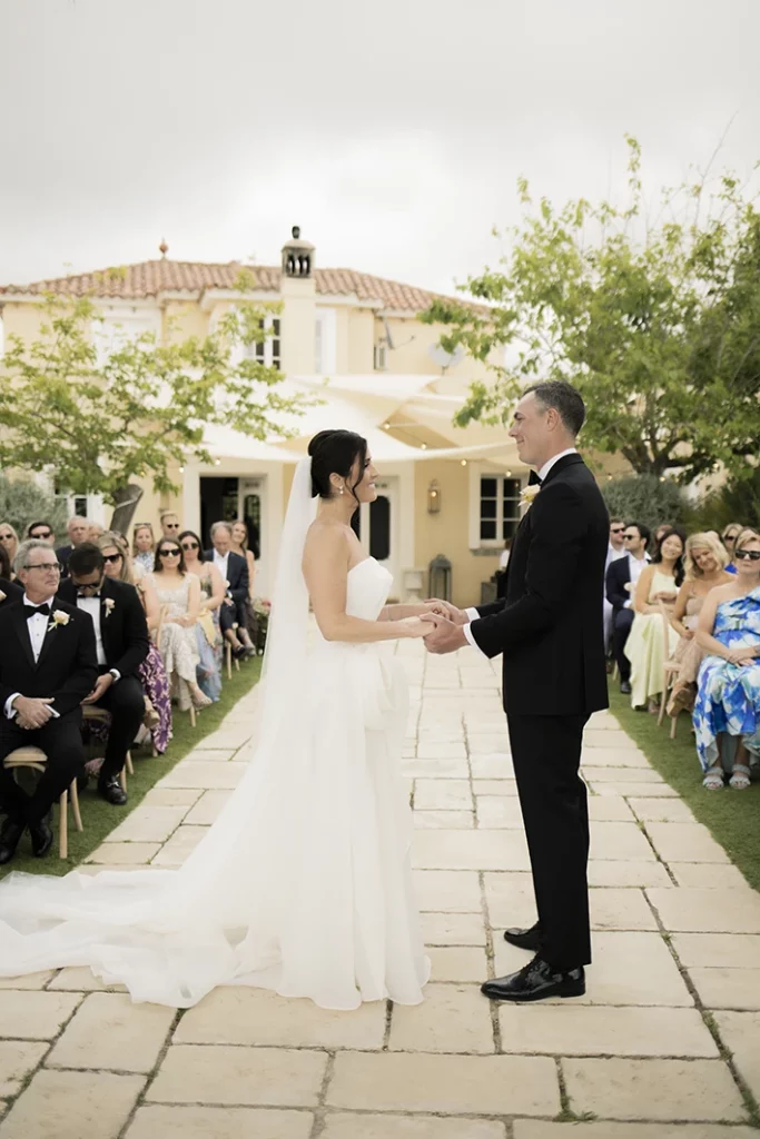 Bride and groom exchanging vows at a luxury wedding in Sitges.