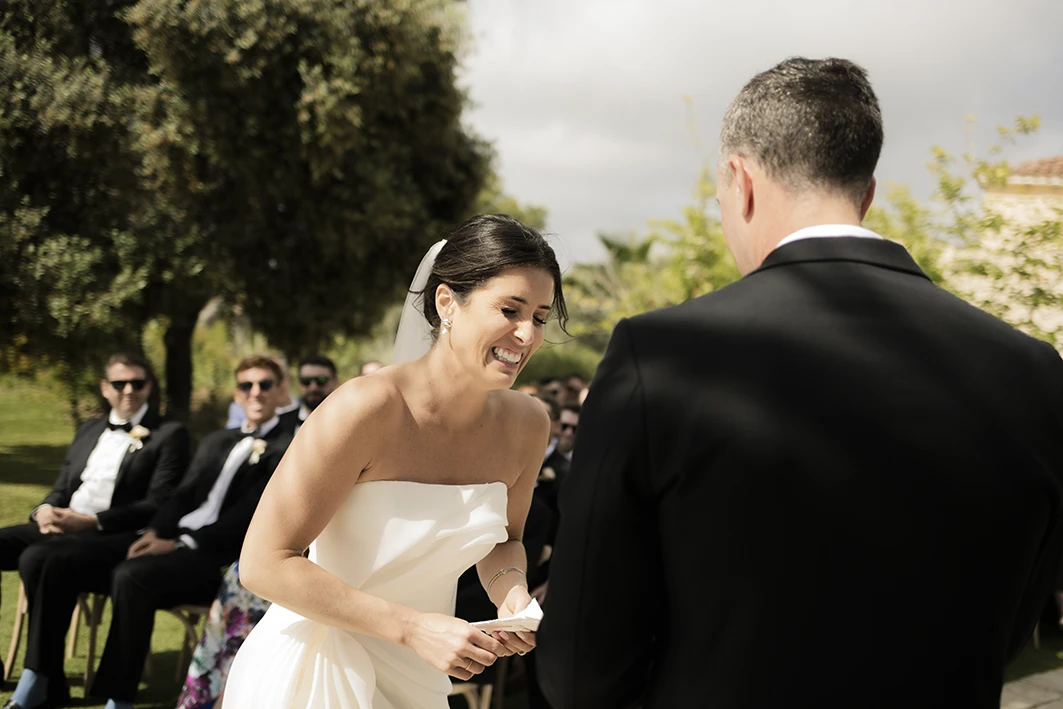 Bride and groom exchanging rings during their luxury wedding in Sitges.