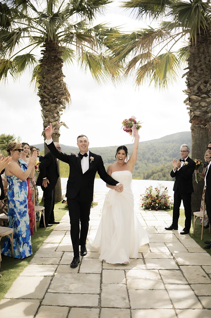 Bride and groom celebrating after saying “I do” at their luxury wedding in Sitges.