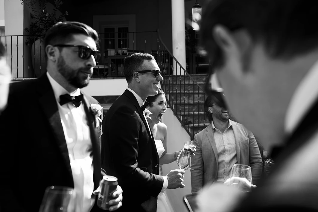 Guests and bride mingling during cocktail hour at a luxury wedding in Sitges.