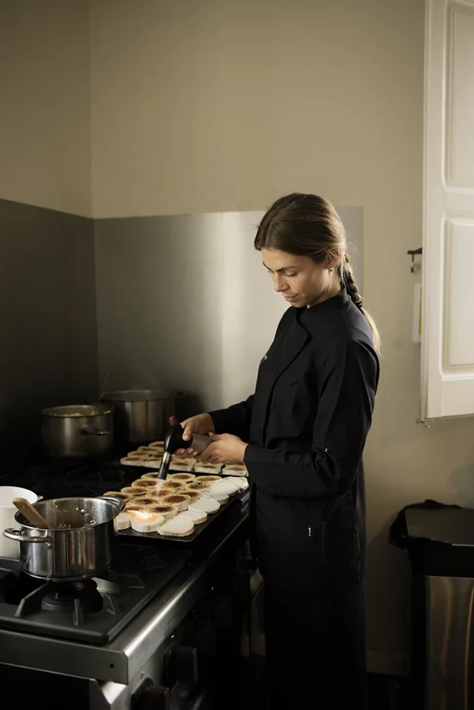 Private chef preparing gourmet dishes for a luxury wedding in Sitges.