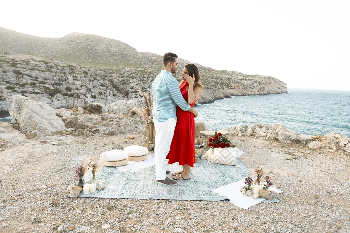 Couple standing by the sea after a surprise wedding proposal in Mallorca