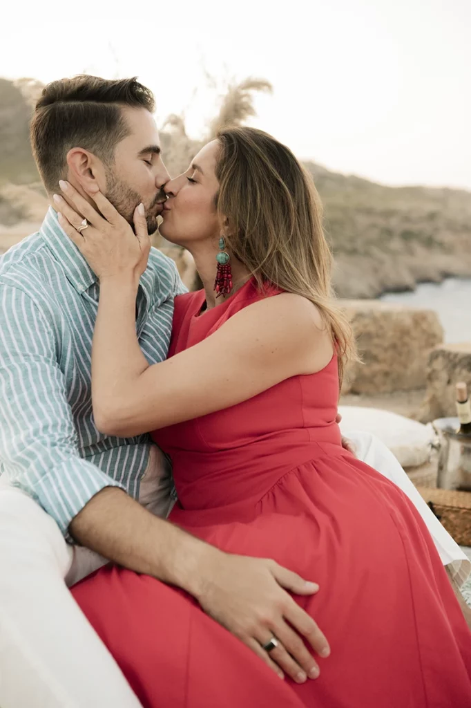 Close-up kiss after a surprise wedding proposal in Mallorca