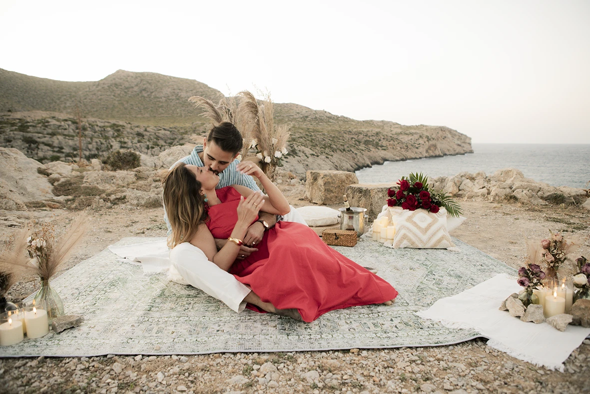 Couple laughing and embracing after a surprise wedding proposal in Mallorca