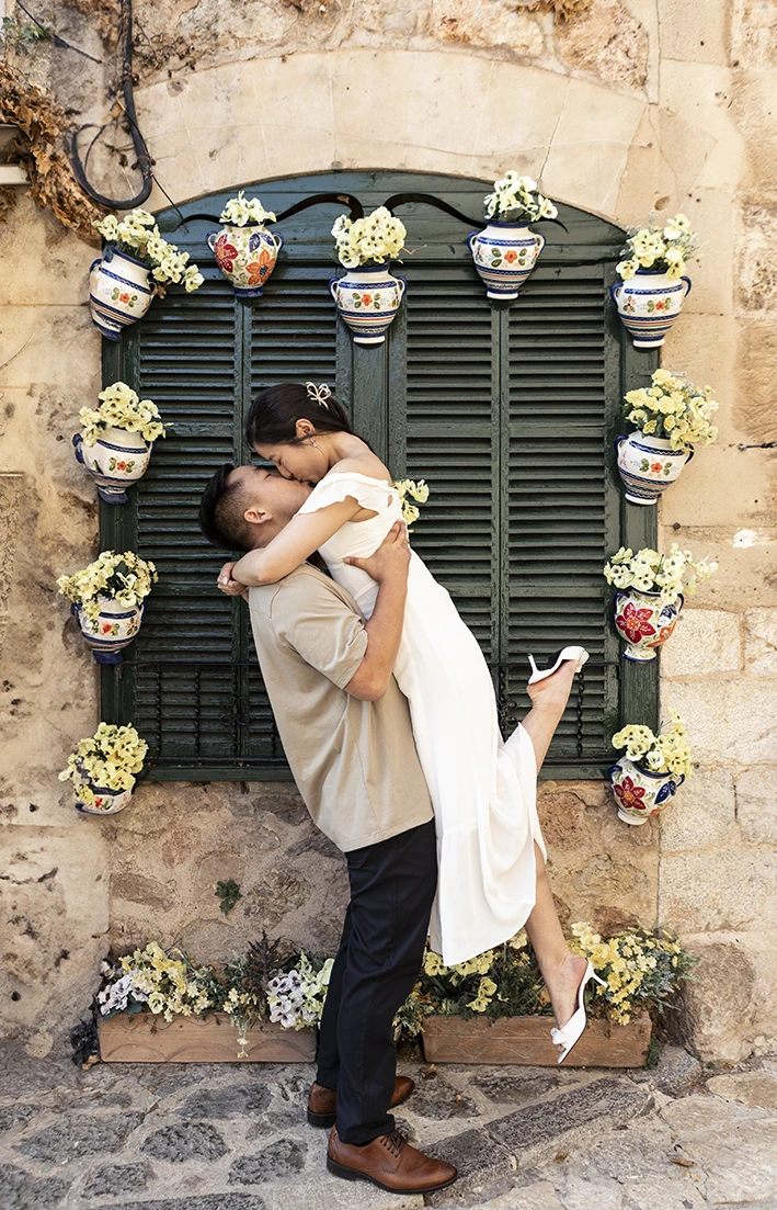 Romantic lift during a surprise proposal in Mallorca.