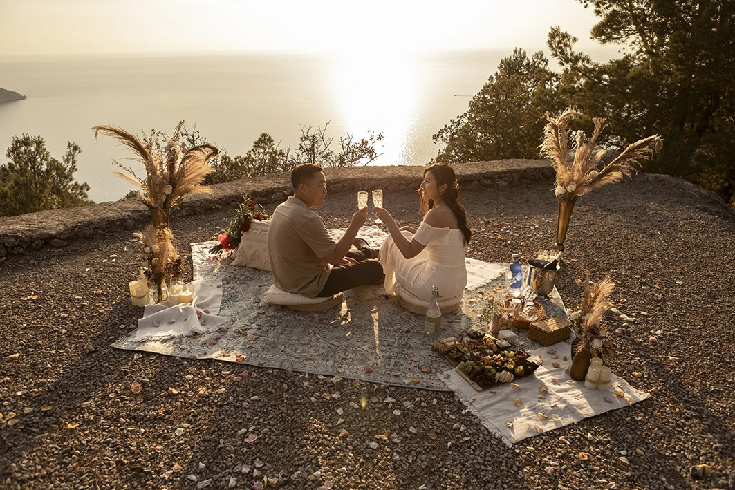 Sunset cheers during a wedding proposal in Mallorca.