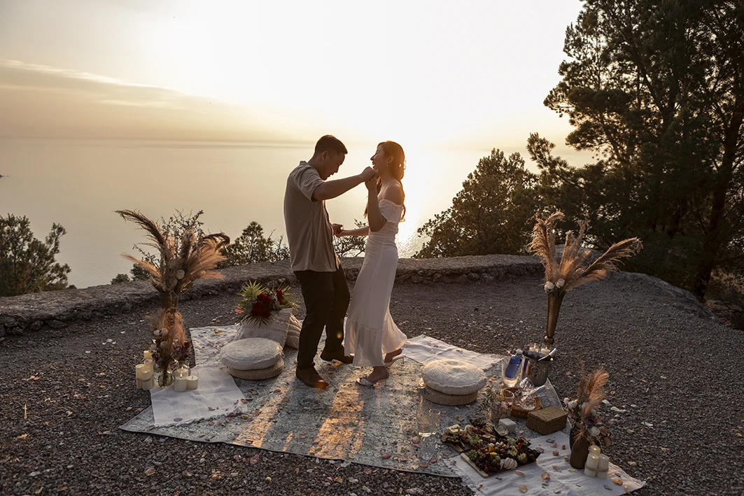 Couple dancing at sunset during a wedding proposal in Mallorca.