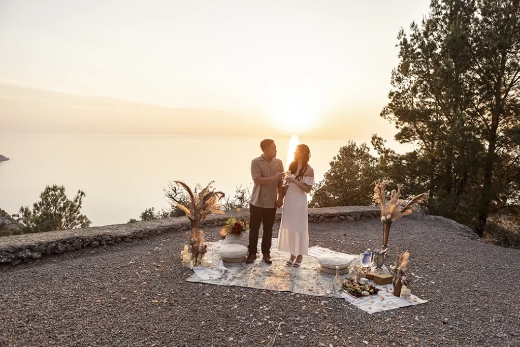 Couple smiling at sunset after wedding proposal in Mallorca.
