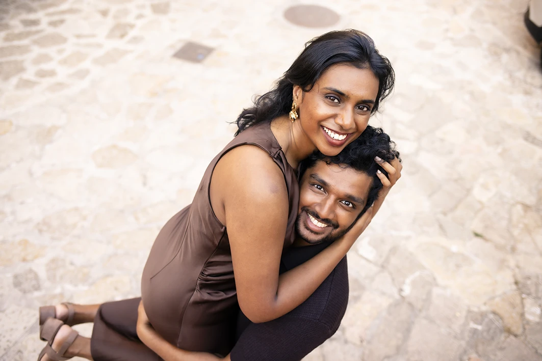 Couple happily embracing after their marriage proposal in Mallorca.