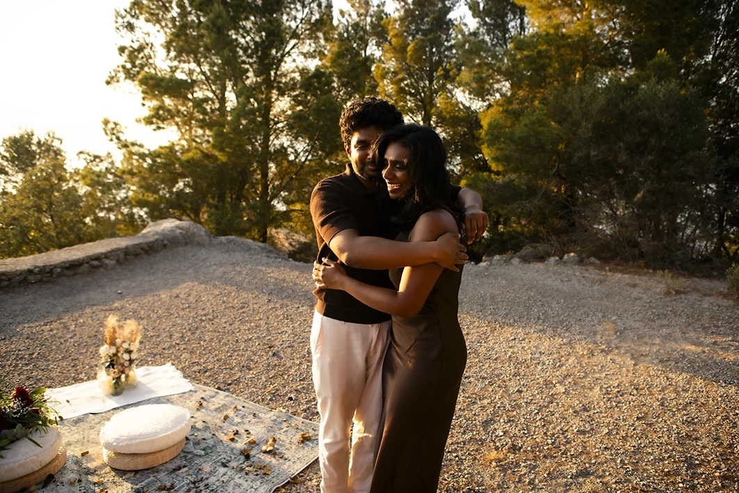 Emotional embrace after a marriage proposal in Mallorca.