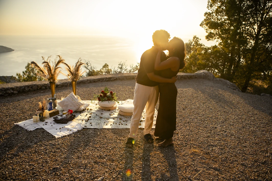 Kiss at sunset after a marriage proposal in Mallorca.