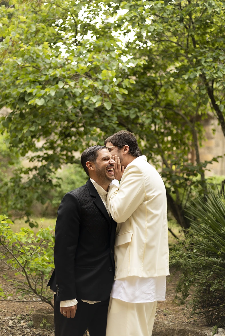 Jon and Santi sharing a tender moment at their wedding at Finca Gordiola.