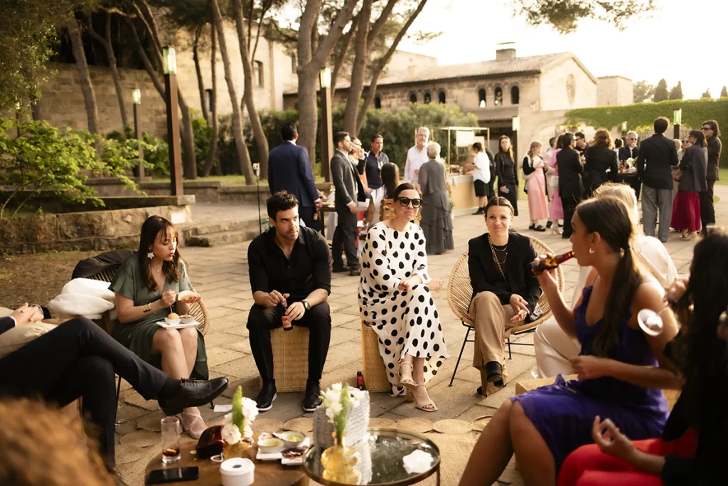 Wedding guests enjoying cocktail hour at Finca Gordiola in Mallorca.