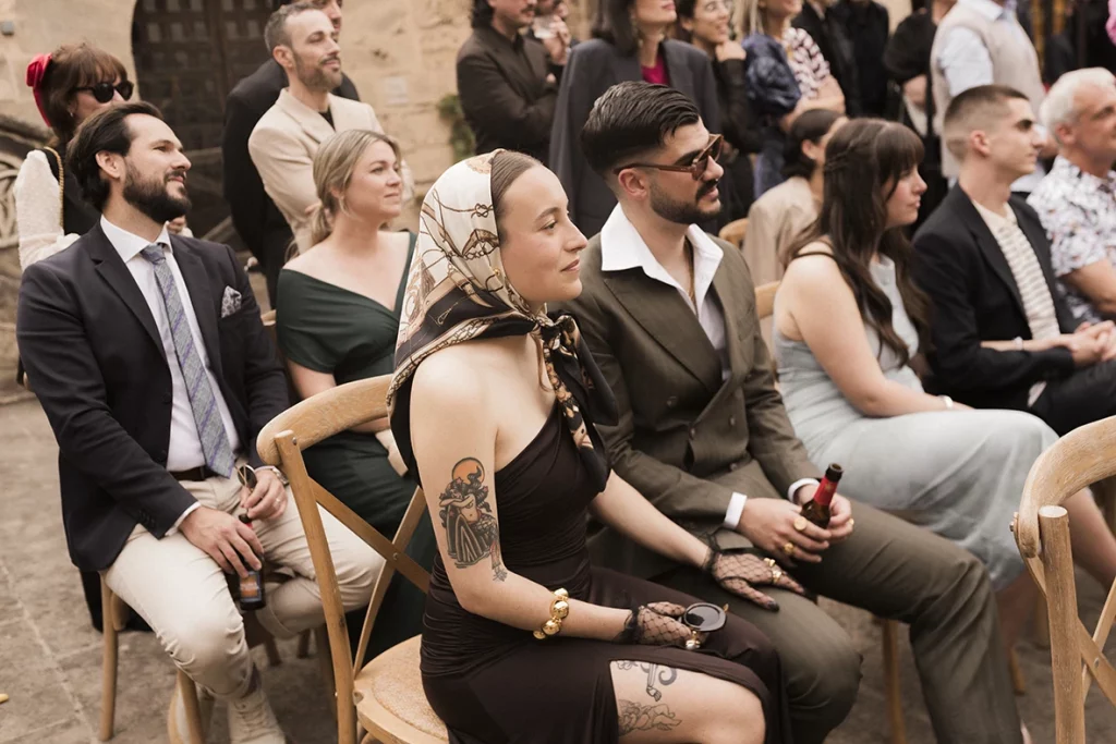 Guests seated and watching the ceremony at Jon and Santi’s wedding at Finca Gordiola.