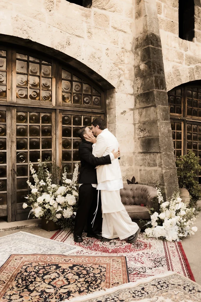 Jon and Santi sharing their first kiss as husbands at their wedding at Finca Gordiola.