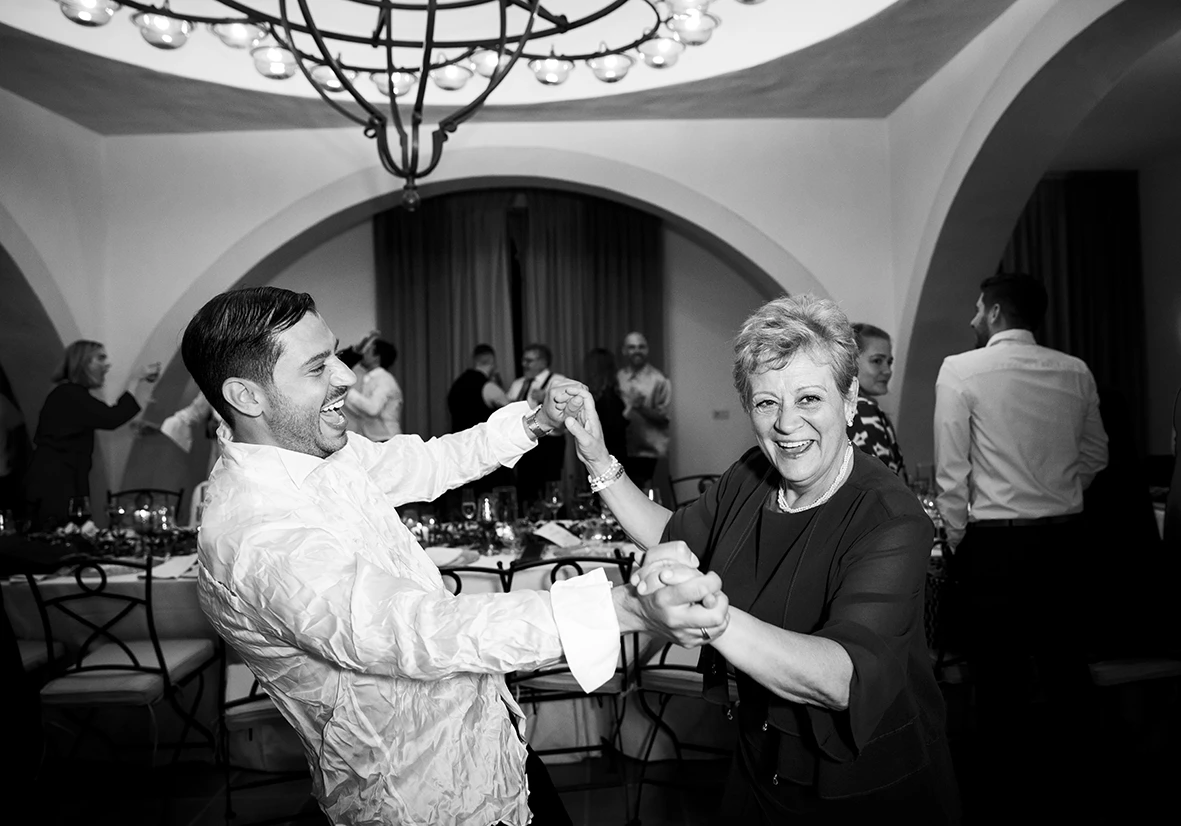 Groom dancing joyfully with his mother at a wedding in Finca Gordiola Mallorca.