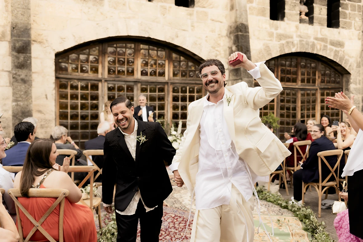 Just married couple exits ceremony at Finca Gordiola Mallorca.
