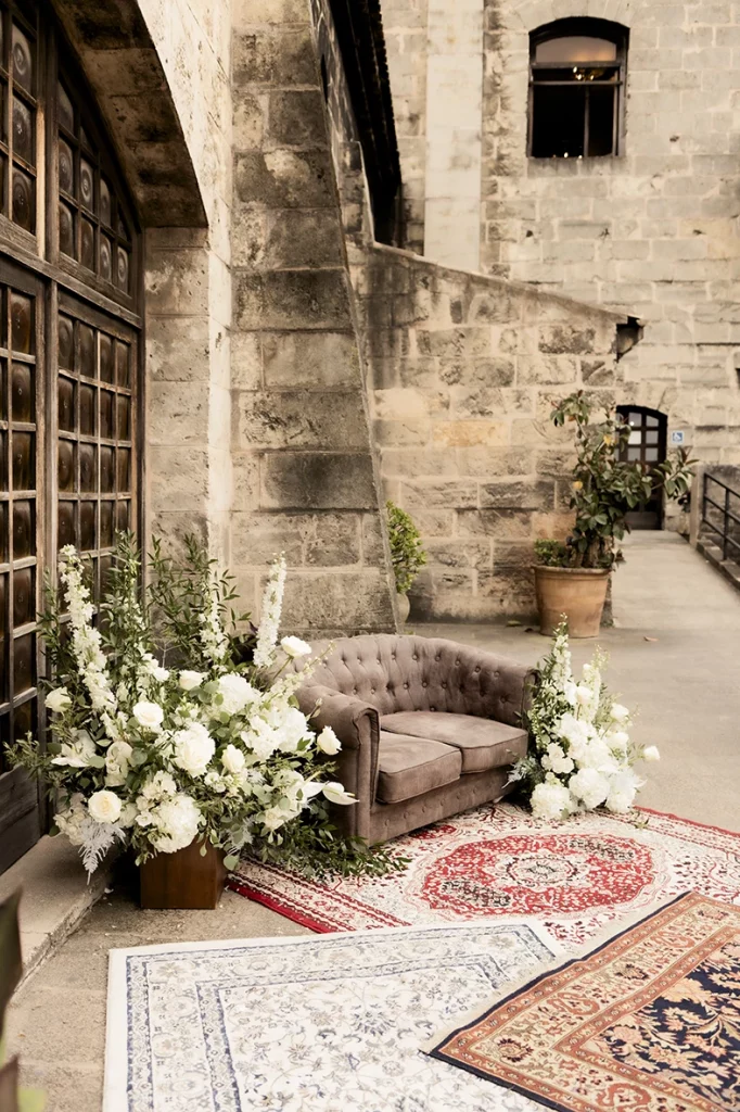 Wedding ceremony setup with flowers and armchair at Finca Gordiola Mallorca.