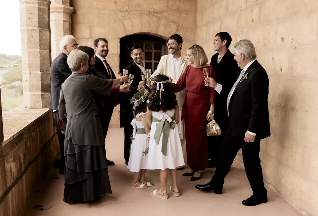 Family greeting the grooms after the ceremony at Finca Gordiola Mallorca wedding.