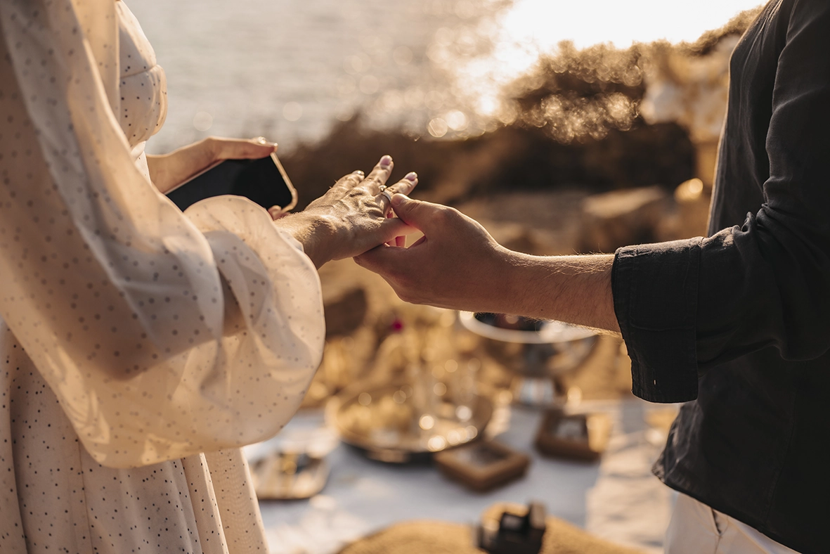 Bride’s hand receiving the engagement ring during the proposal, captured by a photographer for proposals in Mallorca.