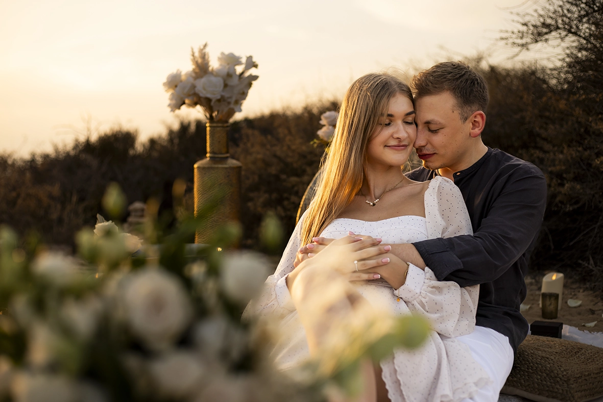 Couple embracing in a romantic sunset setting, captured by a photographer for proposals in Mallorca.