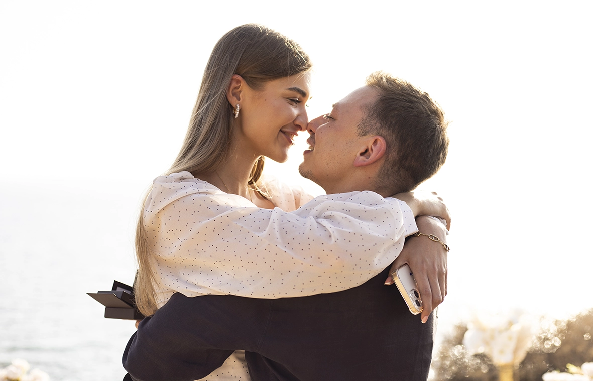 Couple hugging after the proposal in Mallorca, portrait taken by a photographer for proposals in Mallorca.