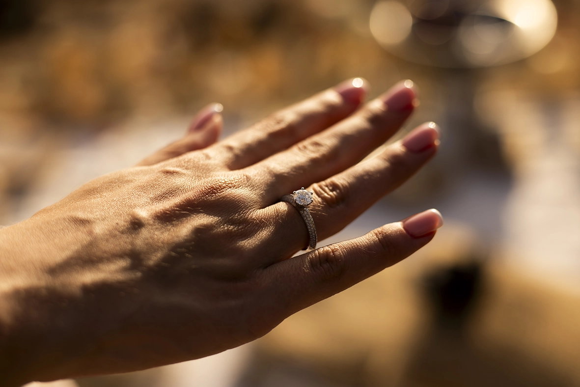 Hand showing the engagement ring after the proposal in Mallorca, captured by a photographer for proposals in Mallorca.