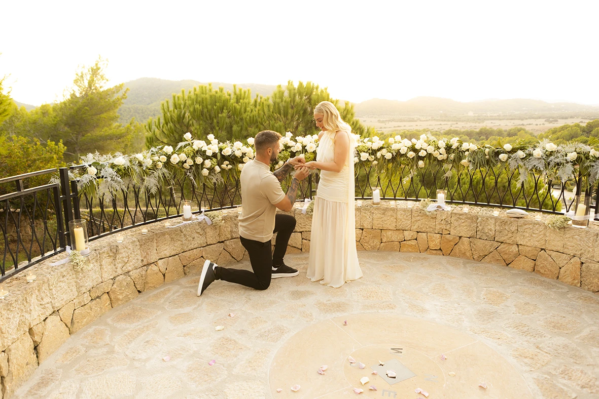 Surprise proposal in Mallorca with the groom-to-be on one knee.