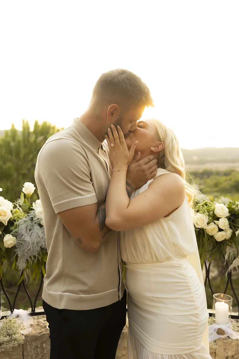 Emotional kiss after a romantic proposal in Mallorca.