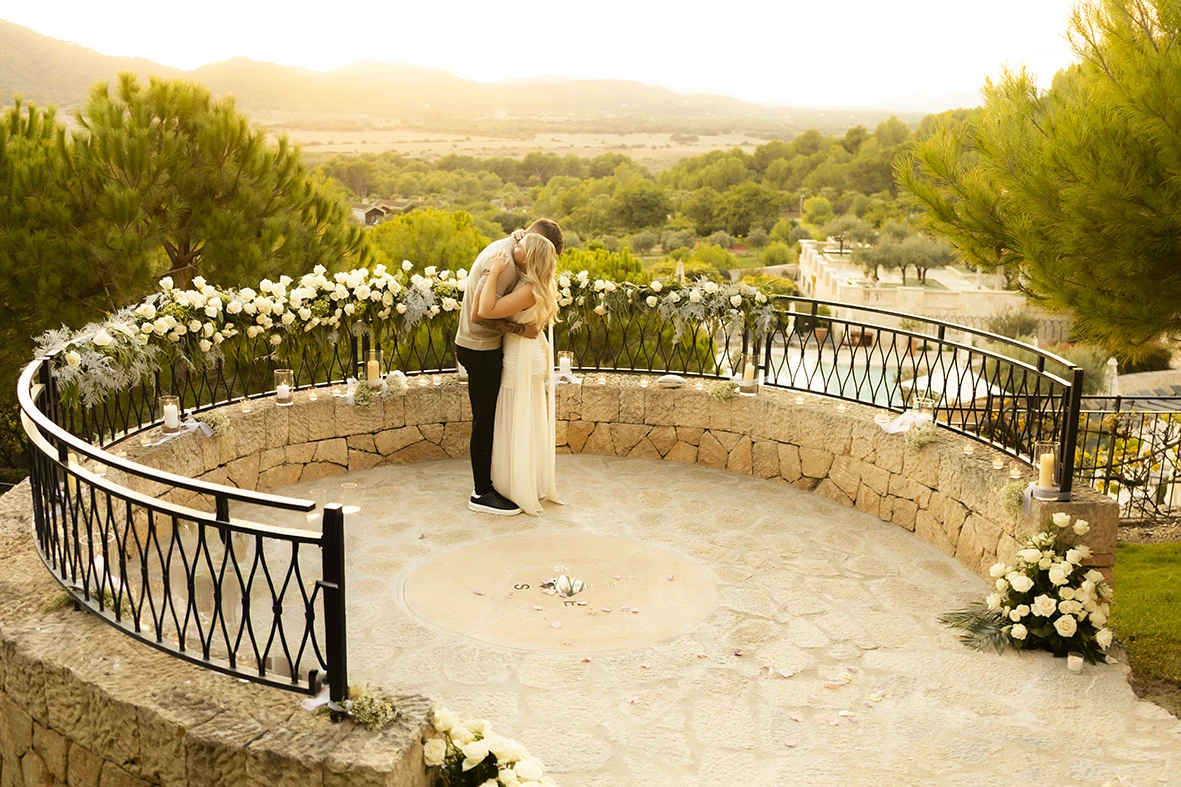 Romantic couple kissing during their proposal in Mallorca.
