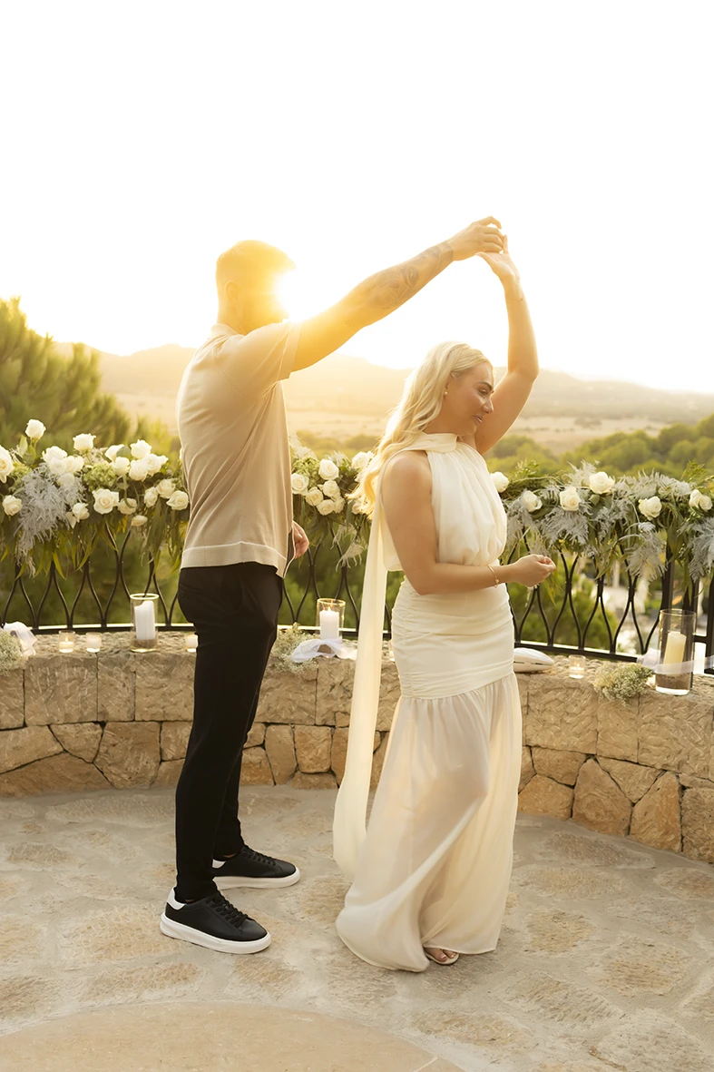 Couple dancing after their romantic proposal in Mallorca.