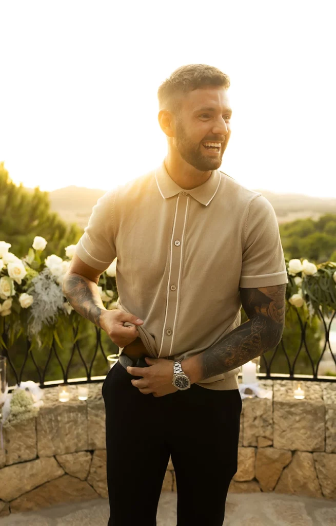 Groom-to-be opening champagne to celebrate engagement in Mallorca.