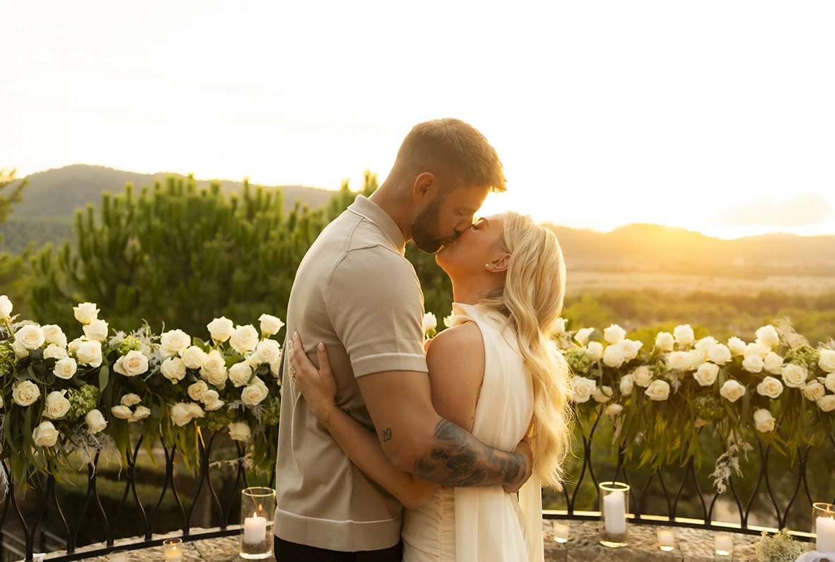 Romantic kiss after proposal in Mallorca.