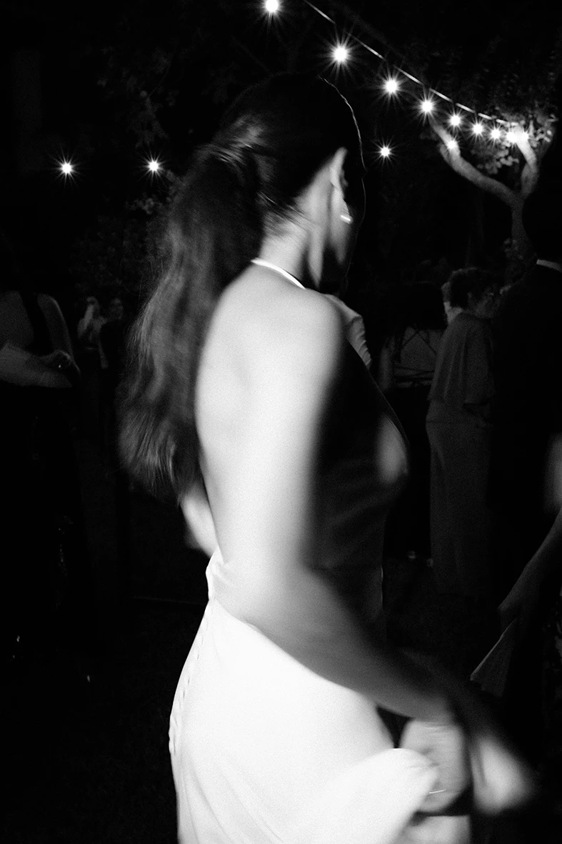 Black and white photo of the bride dancing during her wedding celebration in Mallorca.