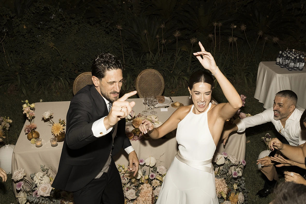 Bride and groom dancing together joyfully at their wedding in Mallorca.