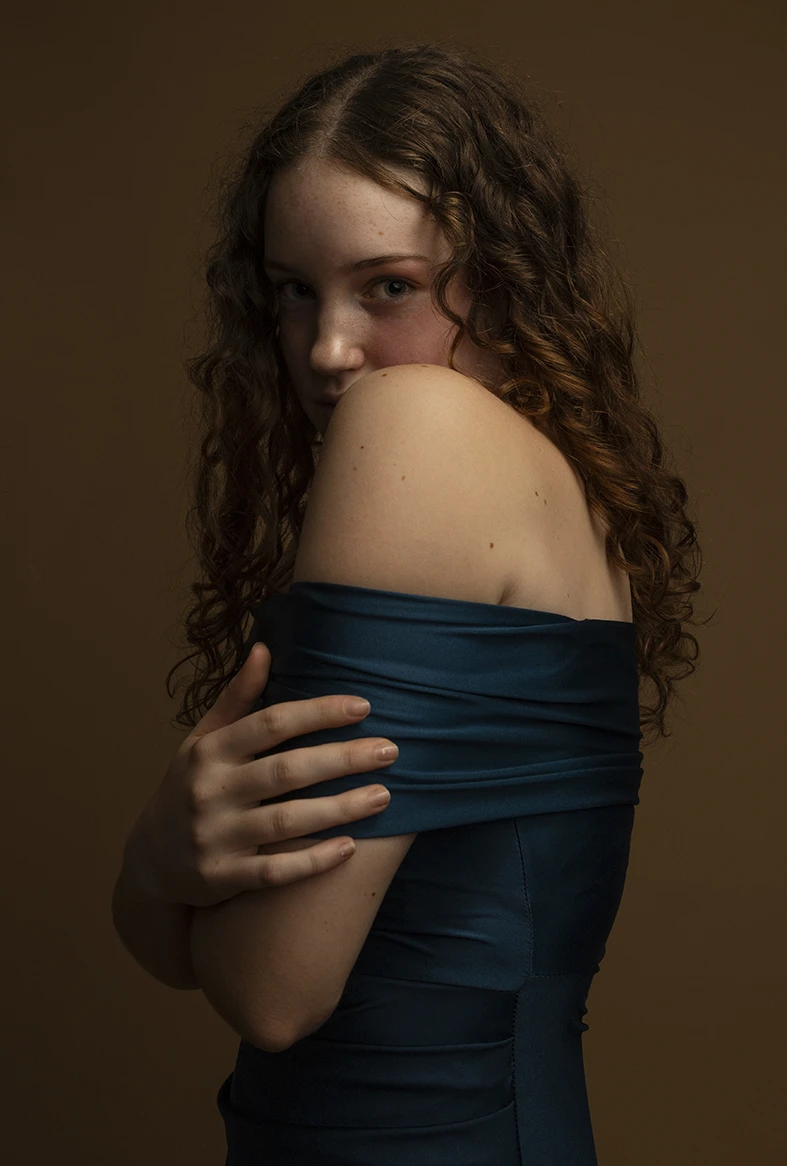 close portrait of a young woman with a soft expression