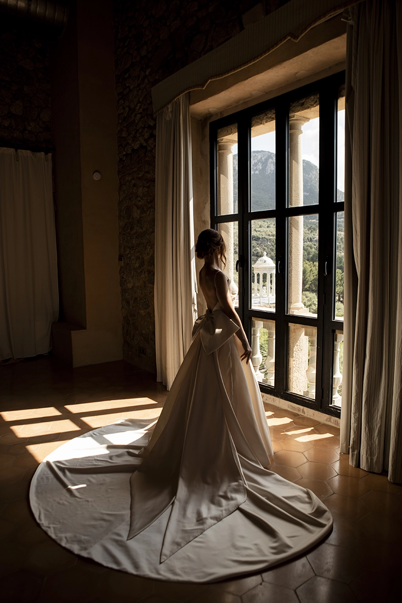 bride by window in Son Marroig Mallorca with natural light