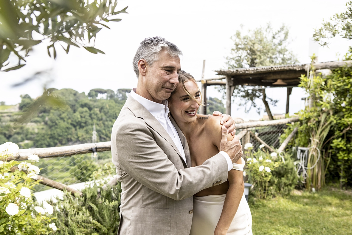 bride hugging her father emotionally during wedding in Mallorca