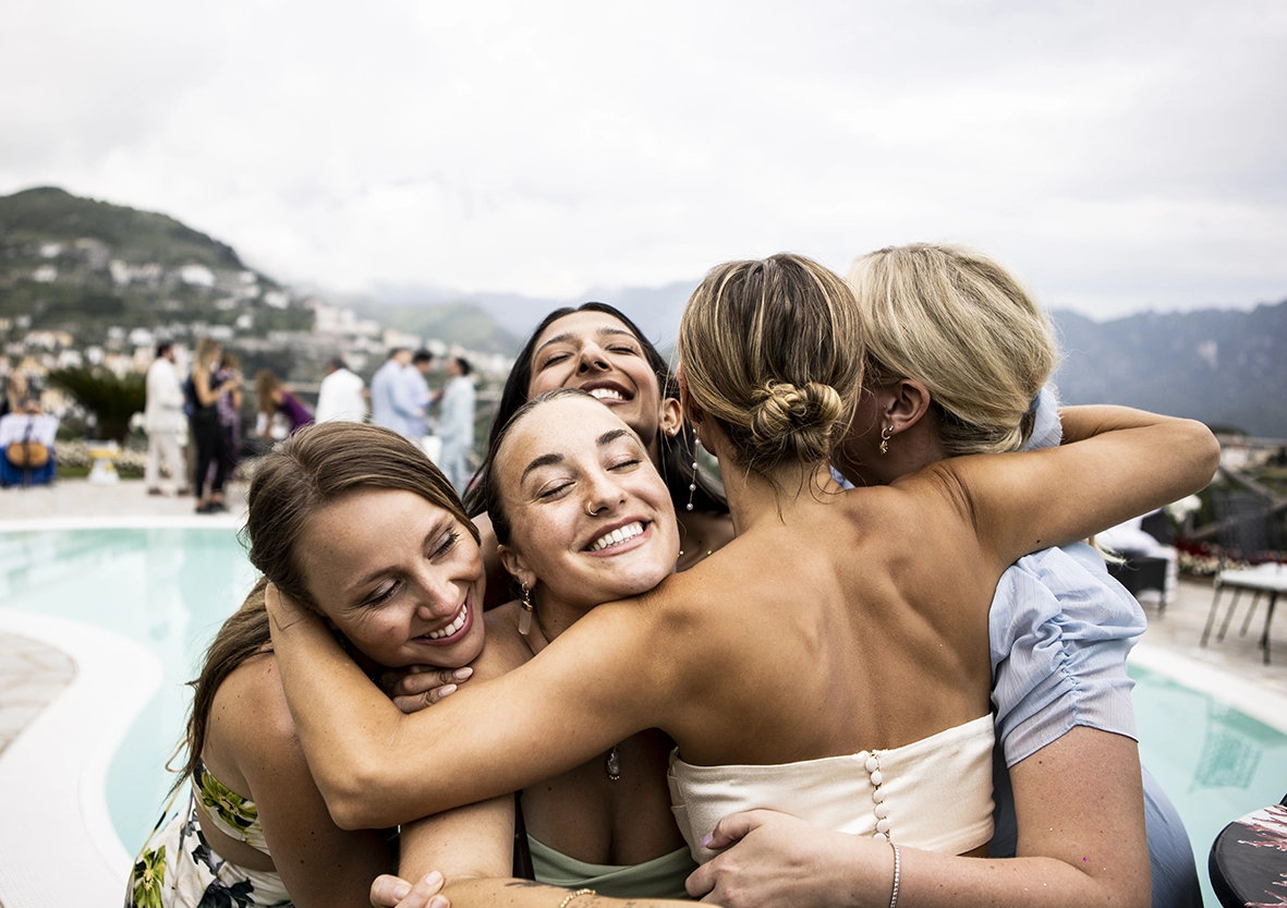 friends hugging emotionally during wedding in Mallorca