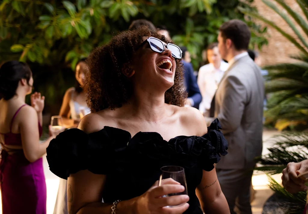 guest laughing during wedding in Mallorca